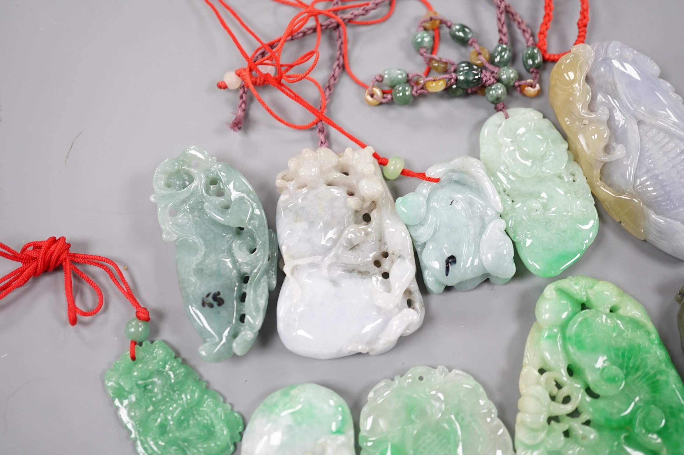 A group of ten jadeite and hardstone carvings and pendants